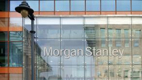 Facade of the modern bank of Morgan Stanley with reflections and a nostalgic lantern in London,