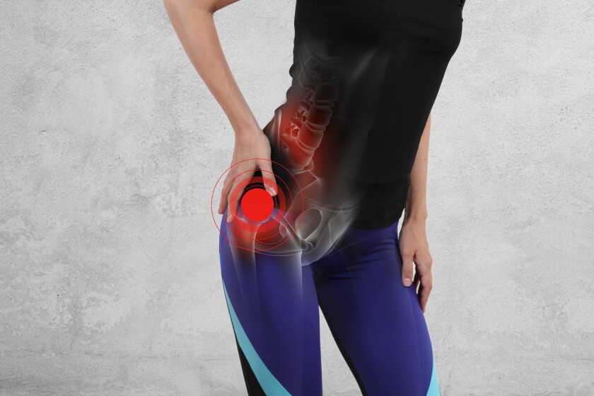 Woman with hip joint pain. Sport exercising injury