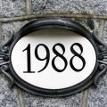 1988 house number on ornate oval plaque