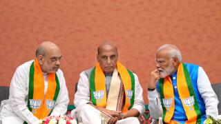 Indian prime Minister Narendra Modi, right, talks to Bharatiya Janata Party (BJP) senior leaders and his cabinet colleagues Home Minister Amit Shah, left, and Defence Minister Rajnath Singh during an event organized to release their party's manifesto for
