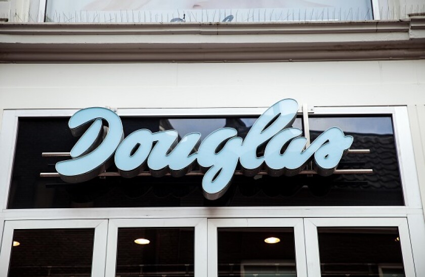 Logo sign on the wall of Douglas shop. Douglas GmbH is a German perfume and cosmetics retailer