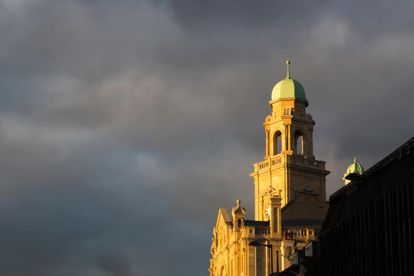 Dark clouds over Chatham Town Hall, Chatham, Kent, UK.