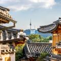 Bukchon Hanok village in Seoul with view on traditional houses roofs and tower in the distance in Seoul South Korea