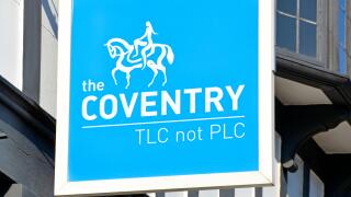 Sign above "The Coventry Building Society" branch premises in Stratford upon Avon includes slogan "TLC not PLC" and Lady Godiva