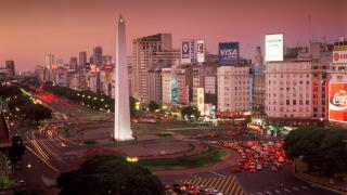 Avenida 9 de Julio at dusk in Buenos Aires with Obelisk and traffic