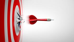 Setting New Goals and Breaking through or overcoming challenges as a dart representing entrepreneurship and unlimited business success focus blasting
