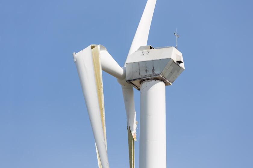 Wind turbine with broken wings after a heavy spring storm in the Netherlands