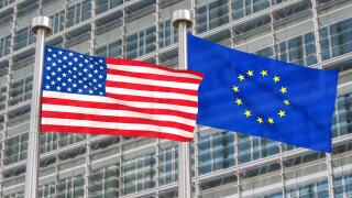 US and European flags waving in the wind (3D rendered)