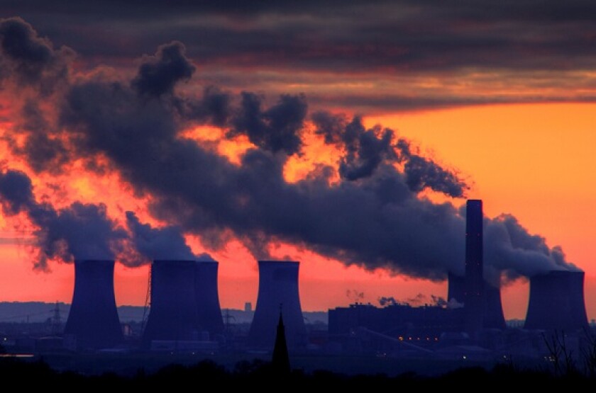 Fiddlers Ferry Power station shown at sunset from Warrington and the village of Stockton Heath - in use before March 2020