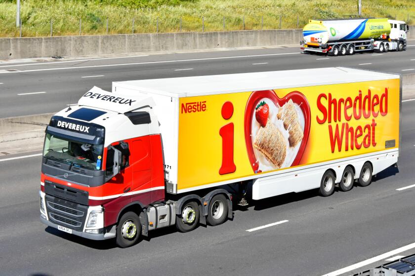 Nestle Shredded Wheat advert on articulated trailer food chain logistics distribution hgv truck lorry driving along UK motorway