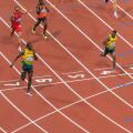 Usain Bolt crosses line with finger to lips, looks at Yohan Blake, Men's 200m final, London 2012, Olympic Games, London, UK