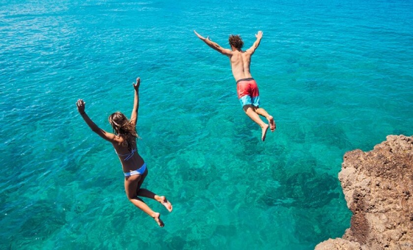 Jumping into water from Alamy 5May22 575x375