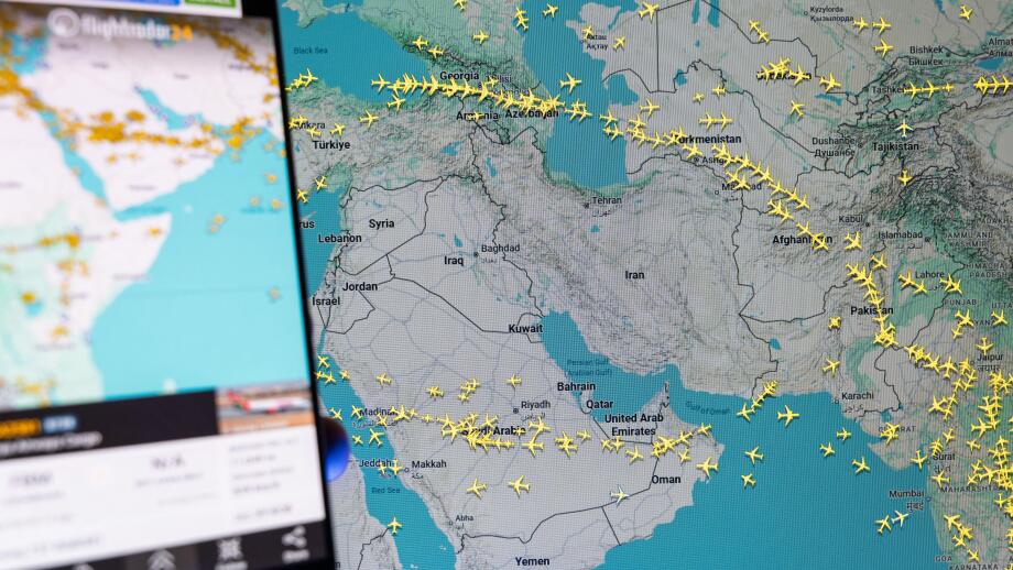 Flightradar24 mobile app displaying real-time global flight tracking map over the Middle East and Iran, aviation monitoring and commercial air traffic