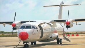 View of a turboprop-engine aircraft stopped at the airport for refueling.  LAMPEDUSA, ITALY - AUGUST, 2019