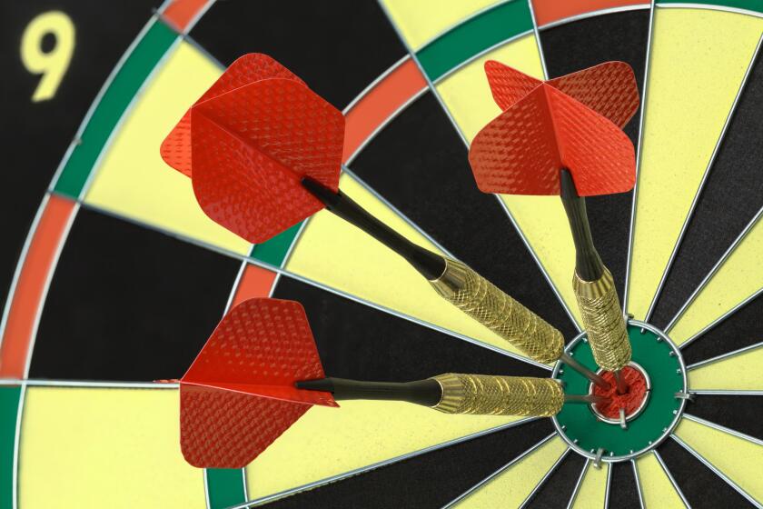 Three darts in the bullseye on Dart Board.