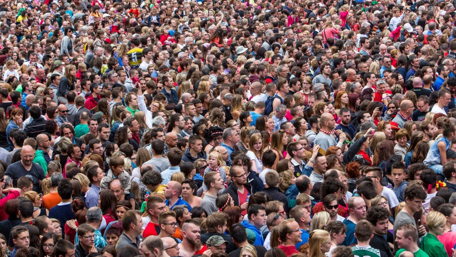 Crowd, many people in confined space, at a festival,