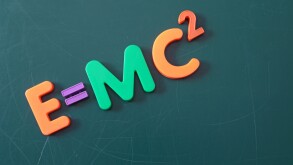 The famous theory of relativity shown on a chalkboard symbolizes education.