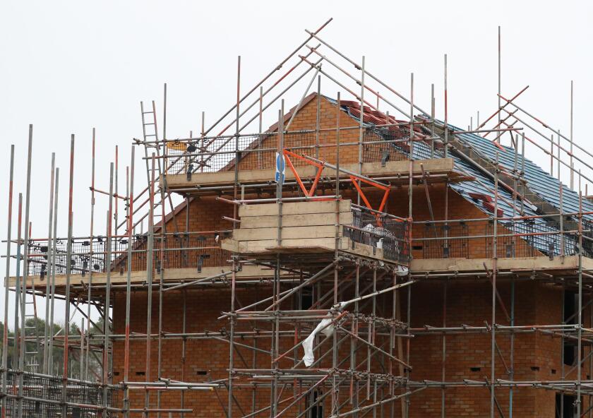 File photo dated 07/01/20 of houses under construction on a housing development in Basingstoke, Hampshire. The UK's construction sector saw growth ease back last month after striking a two-year high in September, according to new data. It was partly drive