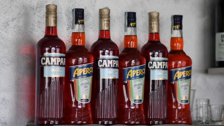 Cremona, Italy July 19th 2025 Several bottles of Campari and Aperol, two famous italian aperitifs, are standing on a bar shelf, ready to be served
