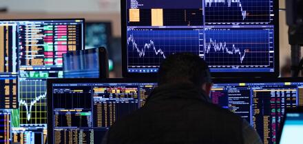 A trader works on the floor of the New York Stock Exchange, Tuesday, March 11, 2025. (AP Photo/Richard Drew)
