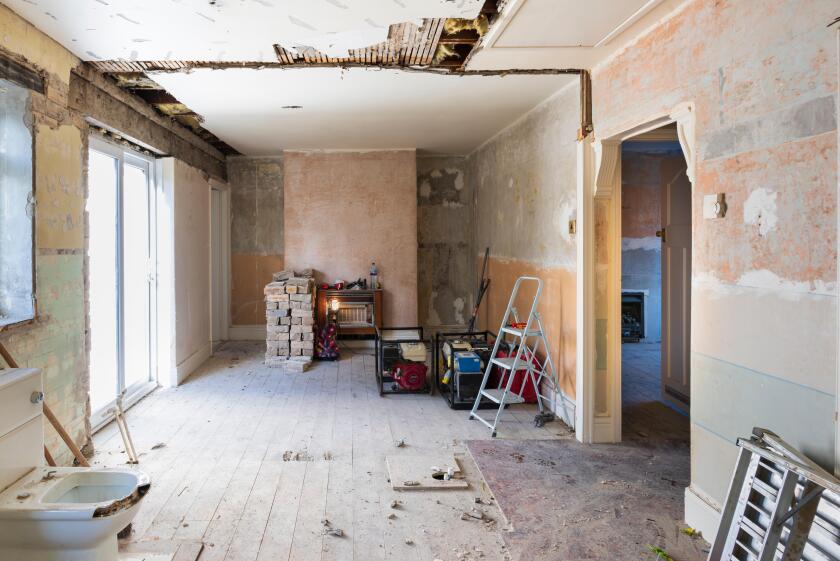 Home DIY renovation gutted empty house interior bare walls