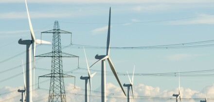National Grid electricity transmission lines and pylons next to Nordex wind turbines at Little Cheyne Court wind farm Rye Sussex. Image shot 10/2010. Exact date unknown.