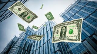 Dollars falling from corporate city office buildings skyscrapers