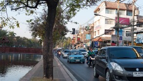 Busy road alongside the Ping Canal in Chiang Mai, Northern Thailand.