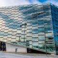Copenhagen, Denmark - August 27, 2019: Low angle shot of The Crystal (Krystallen) designed by Schmidt Hammer Lassen, modern office building of the Nyk