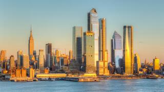 The mixed-use Hudson Yards real estate development and other buildings on the West Side of Manhattan in New York City at sunset.