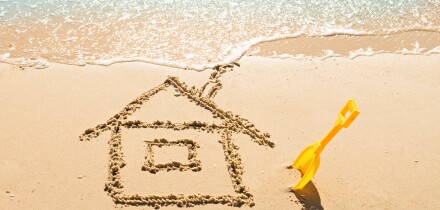 drawing of a house on the beach - concept safety and vacation
