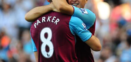 West Ham United's Mark Noble (right) celebrates with team mate Scott Parker, after his effort deflects off Blackburn Rovers' Christopher Samba to give West Ham United their second goal of the game.