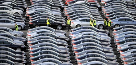 A WORKER WALKS AMONGST BRAND NEW JAGUAR CARS AT THE CAR COMPANYS FACTORY AT CASTLE BROMWICH,BIRMINGHAM ,UK.