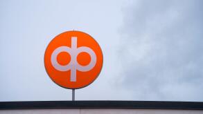 OP Financial Group logo against the overcast sky. Vaaksy, Finland. July 29, 2023.