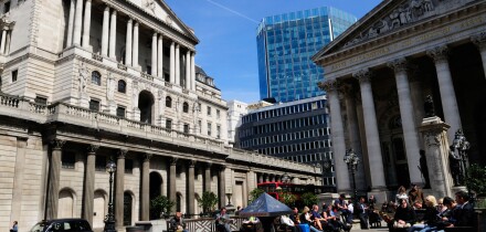 People eating lunch outside The Bank of England and The Royal Exchange, Threadneedle Street, London, England, UK
