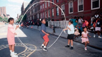 Young girls practice their double dutch skills on a Harlem play street. Image shot 1994. Exact date unknown.