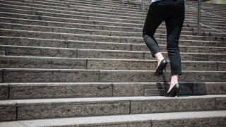 Legs detail of businesswoman climbing stairs