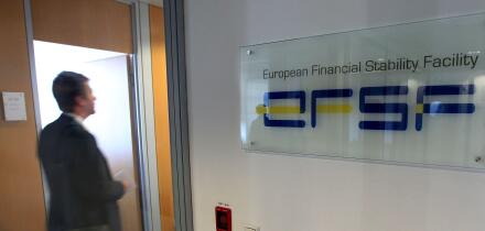 A man walks past at the entrance of the European Financial Stability Facility office in Luxembourg, Monday Oct. 3, 2011. After the Oct. 23 summit of EU leaders, the EFSF will wield massive financial power to contain the eurozone's debt troubles and keep t