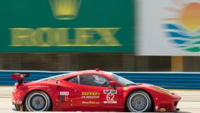 Red Ferarri racing at 12 Hours of Sebring Car race in Sebring Florida