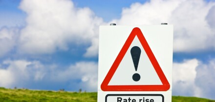 Financial concept warning of interest rates rise ahead sign England UK