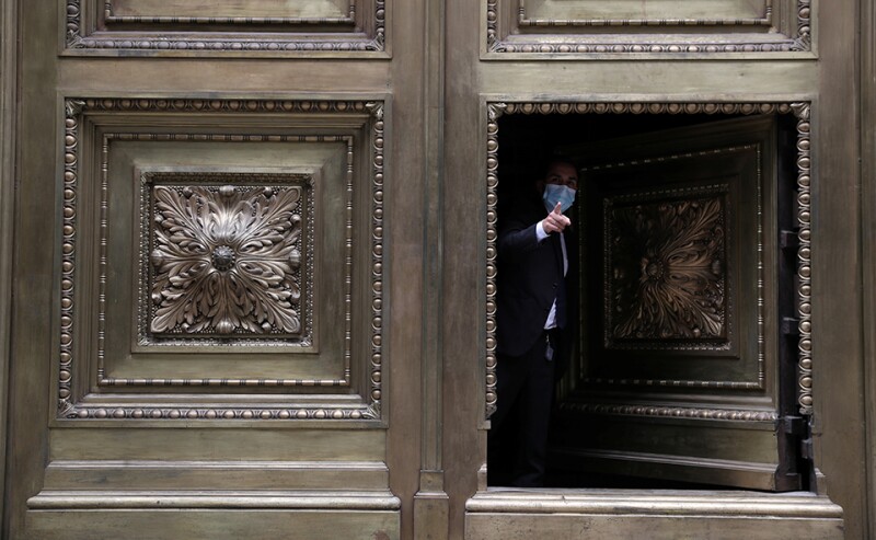 A worker at the door of the Chilean Central Bank building in downtown Santiago.