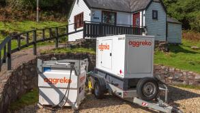 Aggreko Mobile diesel electricity generator on site in a remote countryside location.