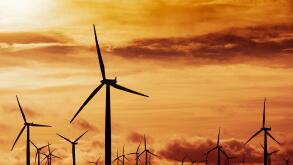 View of wind turbines at sunset at Blacklaw Wind Farm in Scotland, UK