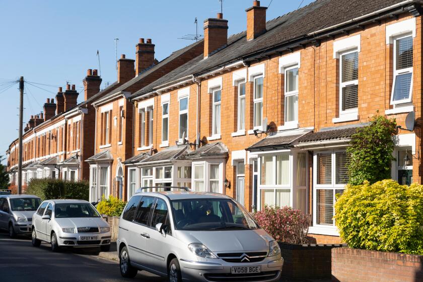 Terraced brick housing, concept - the UK housing market, economy, house prices, renting, mortgages, rental market, letting, landlords