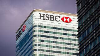 HSBC Bank headquarters building on stormy day in Canary Wharf, Docklands, London, England, UK