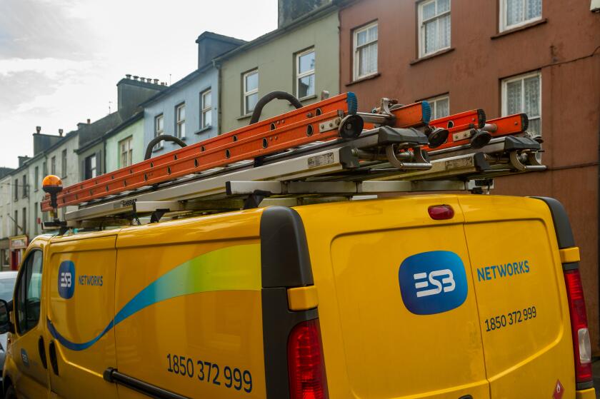 ESB Networks (national Irish electricity company) works van with ladders on roof parked in Skibbereen, County Cork, Ireland.