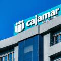 Alicante, Spain, logo or business sign of Cajamar on top of a building. The company offers financial services.