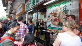 people queuing outside former one dim sum tim ho wan michelin starred restaurant location in mong kok district kowloon hong kong hksar china