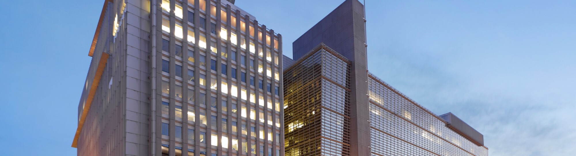 The World Bank Building headquarters main building at dusk. H Building 1818 H Street; Pennsylvania Avenue, Washington DC, USA