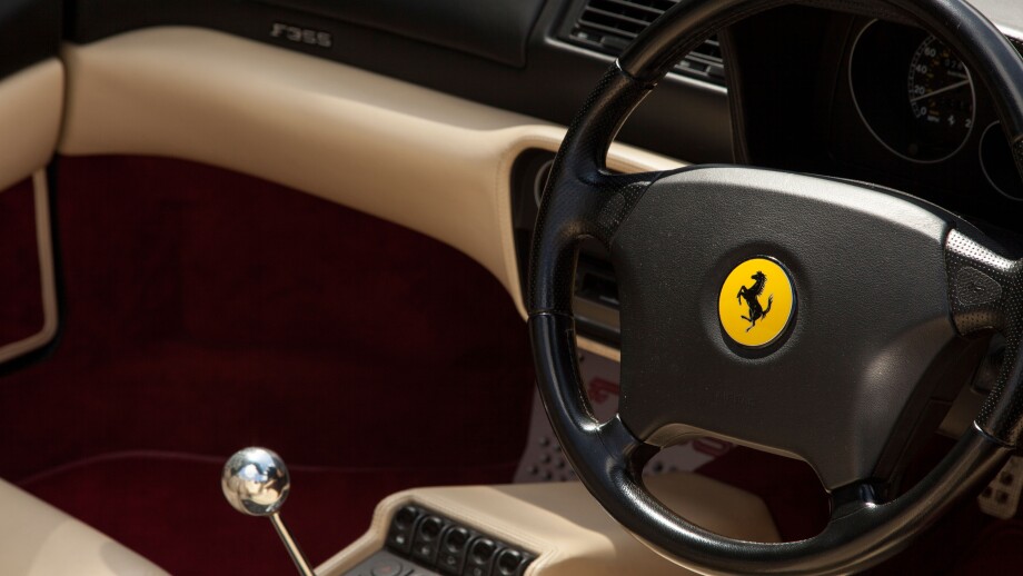 Ferrari interior showing Ferrari steering wheel  and chrome gear stick, F1, Formula, one, auto, racing, motor, sports, car,